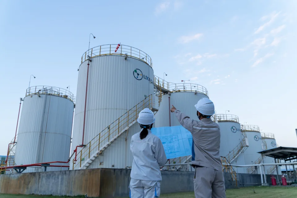 Staff inspecting the tank area