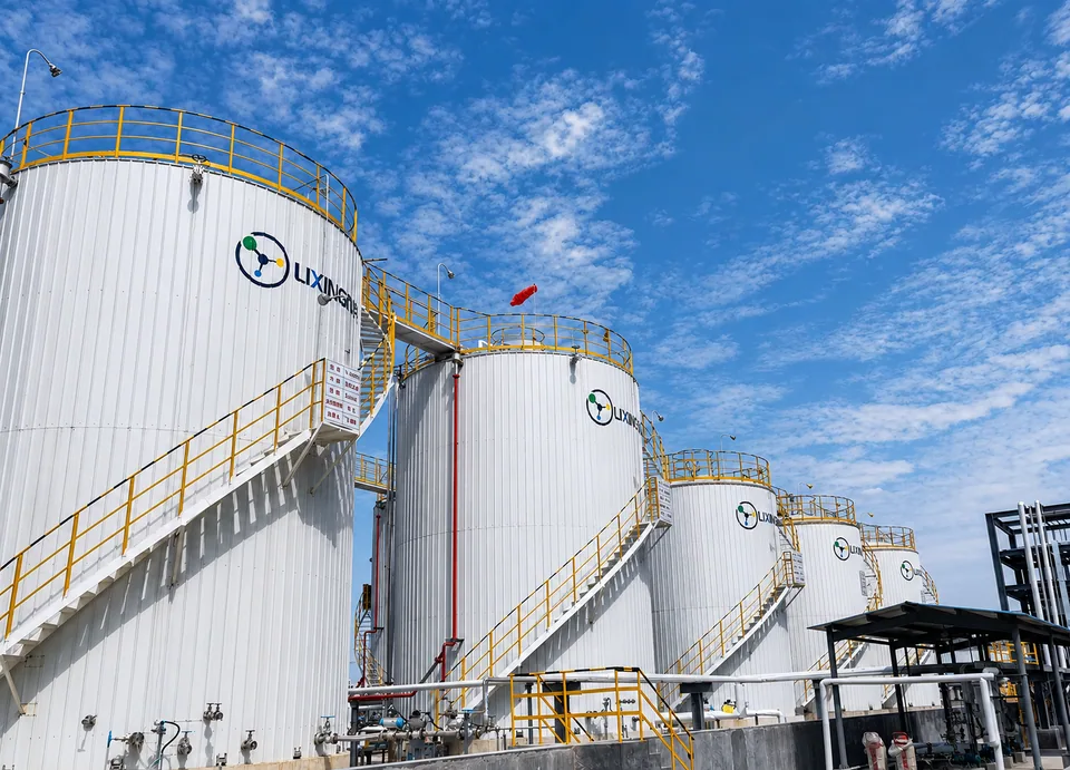 Storage tanks with access stairs and railings